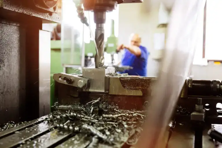 Automated drilling machines processing metalwork for assembly robots