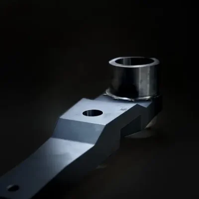 Heavy machined arms designed for strength and accuracy.