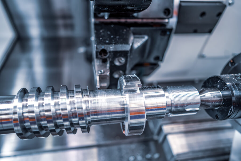 Metalworking CNC milling machine. Cutting metal modern processing technology. Small depth of field. Warning - authentic shooting in challenging conditions. A little bit grain and maybe blurred.